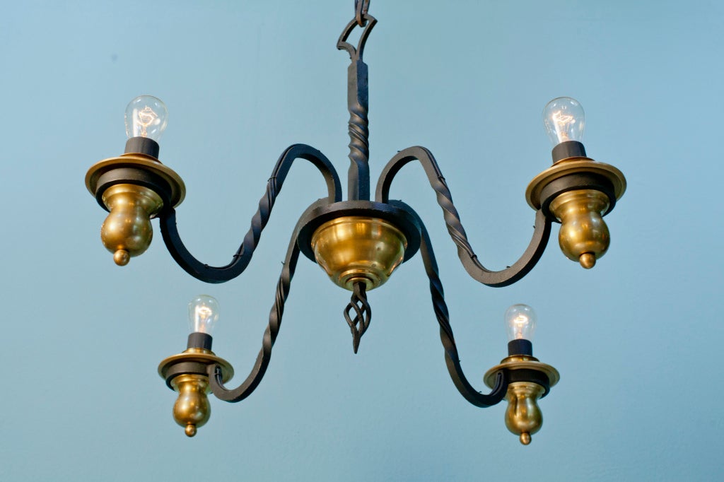 Four-Arm Wrought Iron and Brass Chandelier in the Style of Gilbert Poillerat In Excellent Condition In Houston, TX