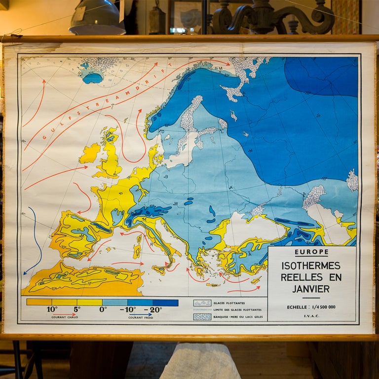 This is a Belgian school chart printed on paper with linen backing, depicting the isothermal index or temperature index for Europe in January. Text is in French. Hangs on it's original wooden dowel rods. Wonderful colors. We have several charts