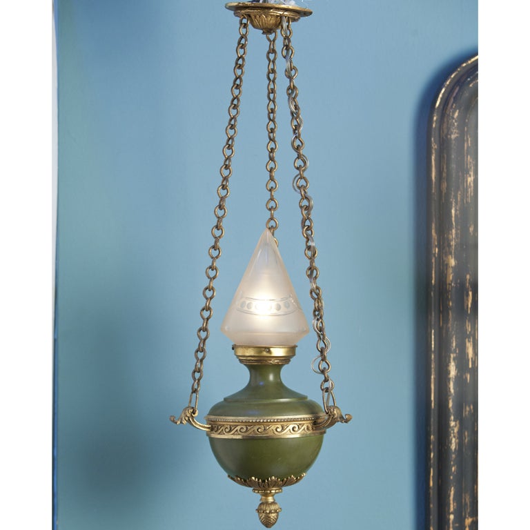 Empire style tole hall light from France (circa 1910). This charming hall light is all original and has been newly wired in the US with all UL listed parts. Beautiful etching on the frosted glass pyramid upright shade. Green painted metal body with