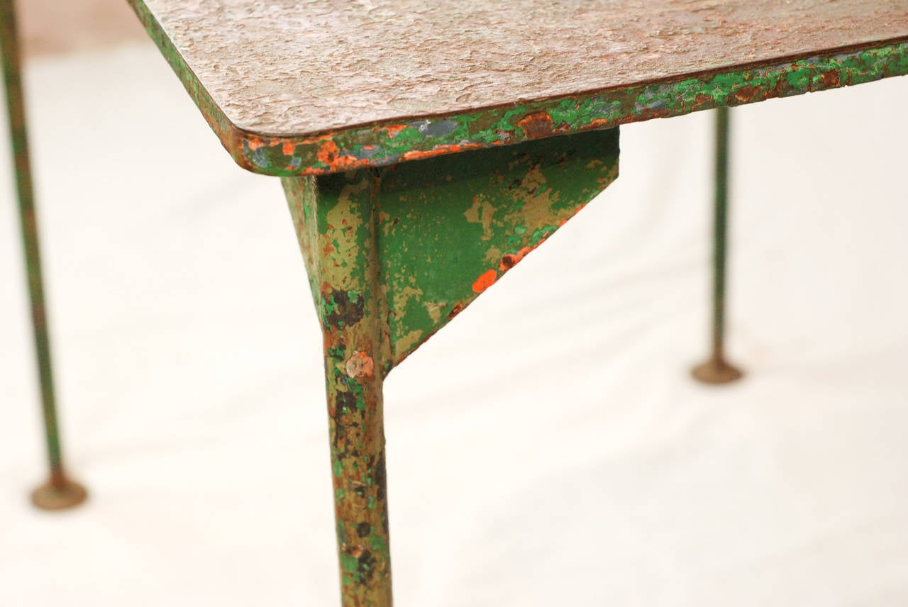 Petite metal work table in original green paint.