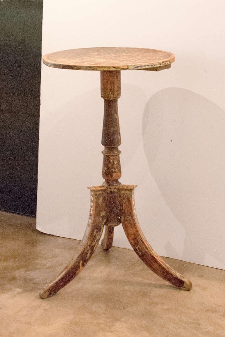 19th century Swedish side table with three sabre style legs in original finish.