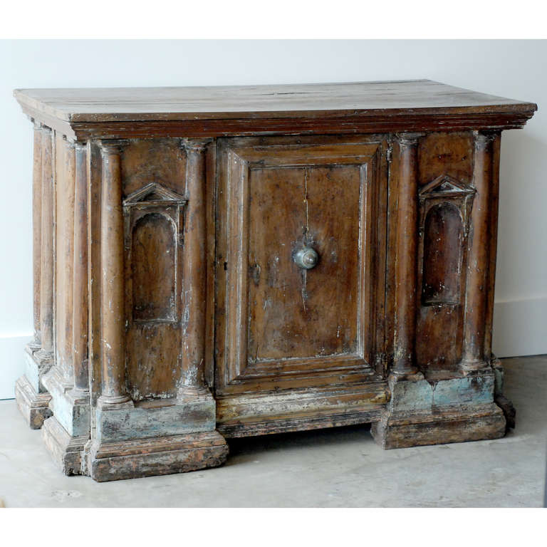 17th century Italian sacristy in walnut, single door with doric column detailing on front and sides, traces of original paint