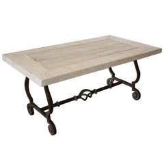 Coffee table with iron base and reclaimed timber top