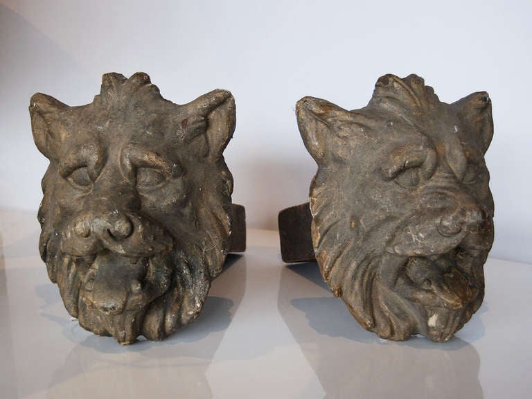 Pair of hand carved wooden lions' heads from French door surround, circa 1830.