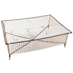 Large woven wire basket with original yellow paint