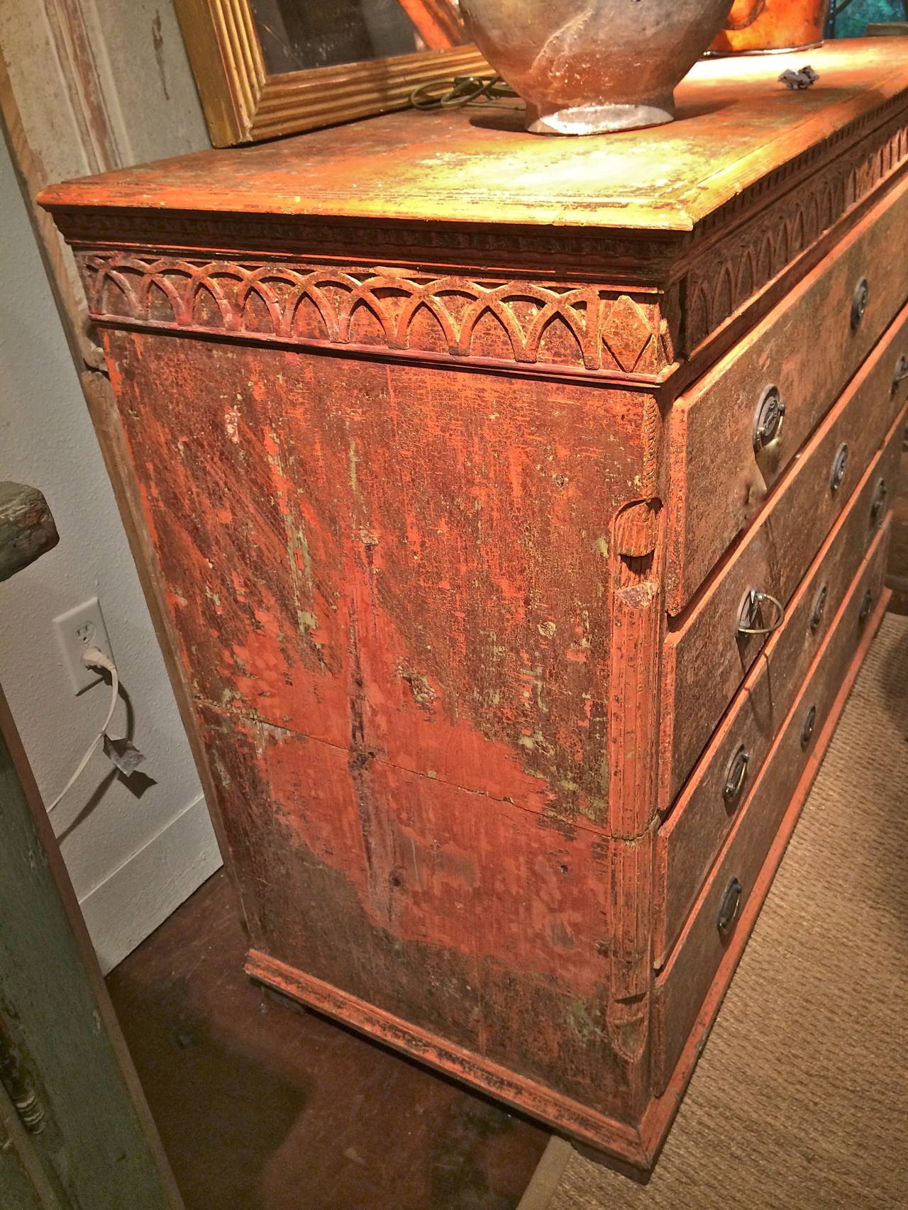 Handsome and large Danish five-drawer commode. Dry scraped to the original salmon paint color. Beautifully carved dental molding and frieze under top with quarter carved columns on front corner. Bracket feet. Working keys for all drawers.
