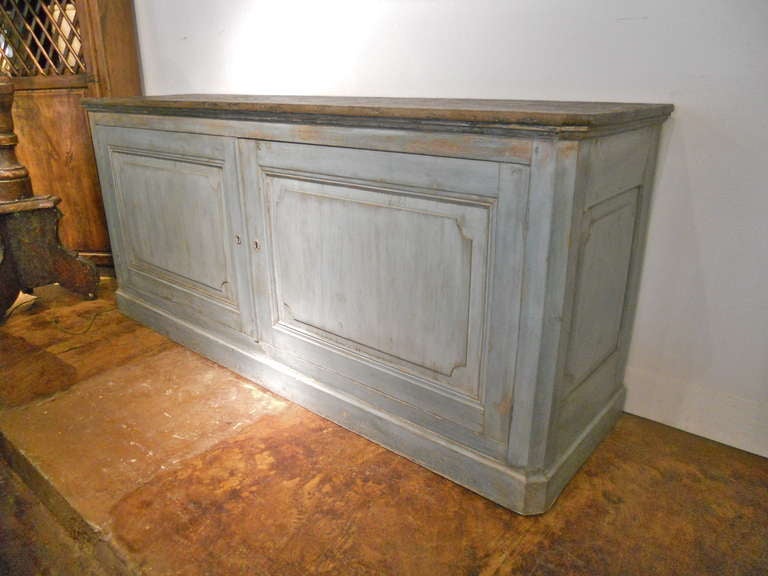 Handsome and large painted buffet . Two wide doors opening to single shelf.