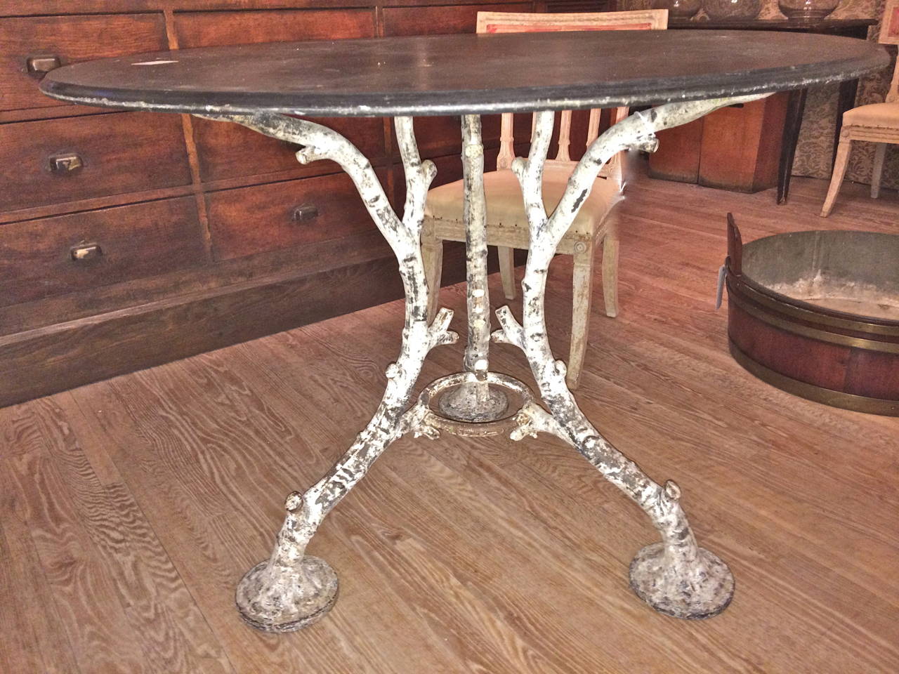 Handsome and unusual French garden table in cast iron faux bois with and old ardoise(slate) top.