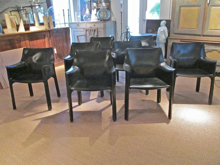 Handsome set of 8 Cassina leather cab chairs by Bellini from the 1970's in black leather.
