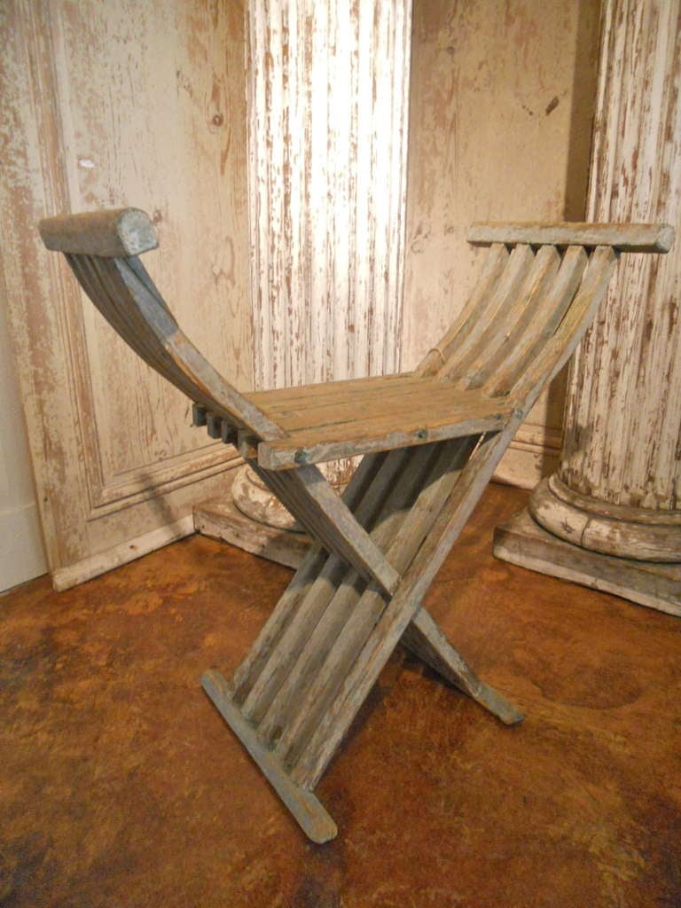 Interesting Swedish folding chair, dry scraped to bluish color paint. Great patina.