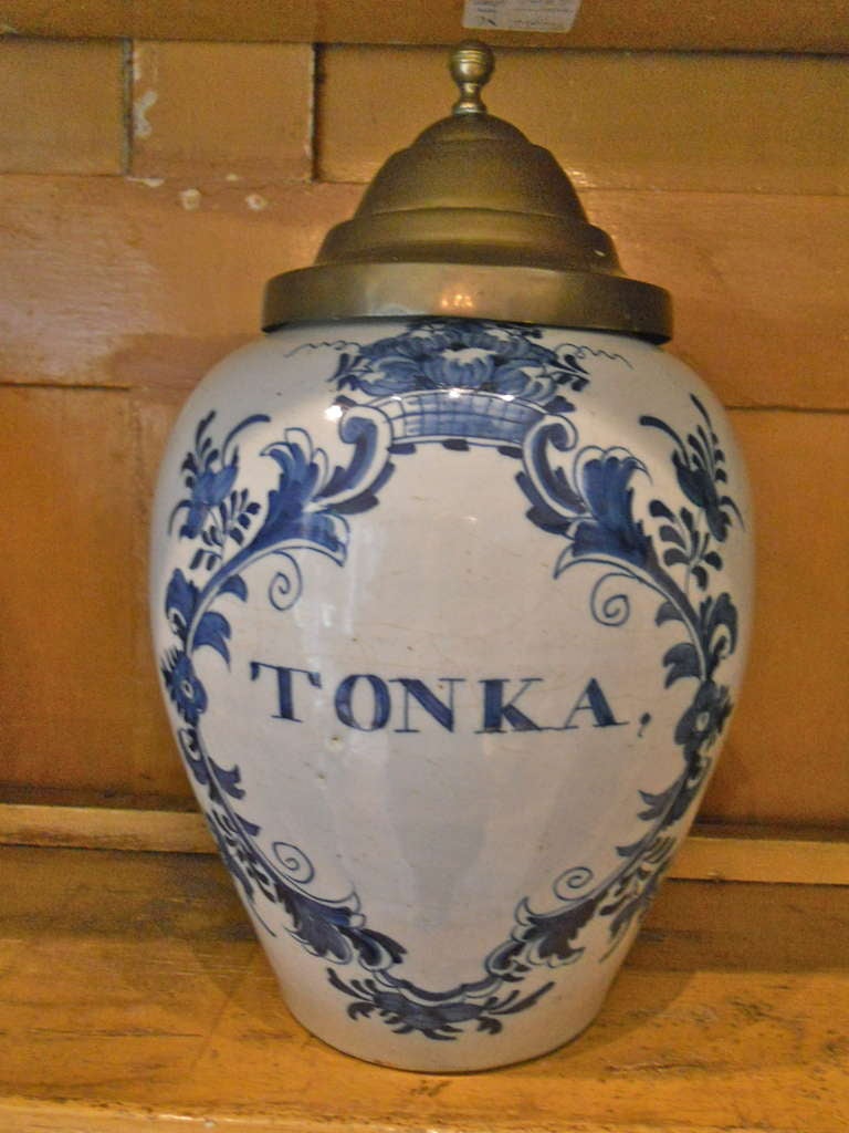 Handsome and large 18th. century Dutch Delft tabacco jar with brass lid. Marked 