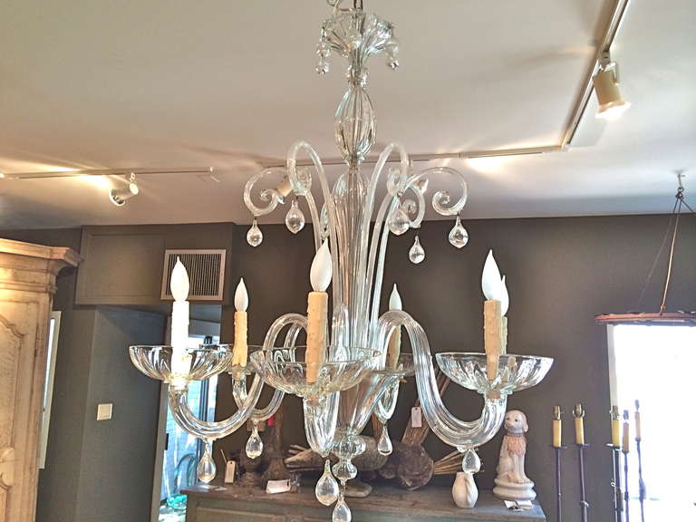 Handsome and simple Italian Murano, six arm chandelier. Large bobeches, arms with tear shaped ball. All clear glass. Perfect condition and newly rewired.