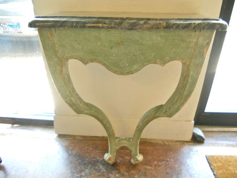 Handsome and smallFrench Louis XV painted console with original marble top. Diminutive size and original paint.