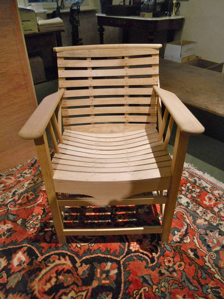 Handsome and comfortalbe hand built custom made arm chairs from Belgium of white oak and beech. Will weather to a silver grey. Copied from a 1920's garden chair. Four pairs available.
