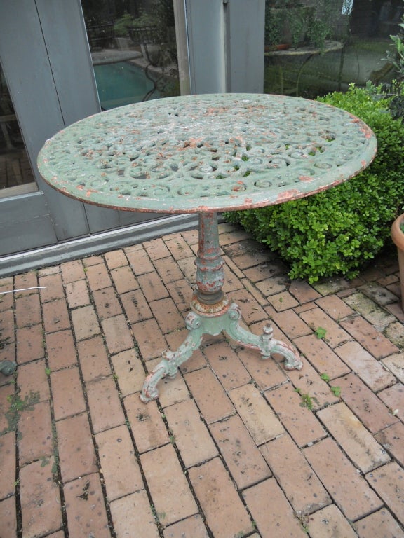 Handsome Italian cast iron garden table with pierced top.