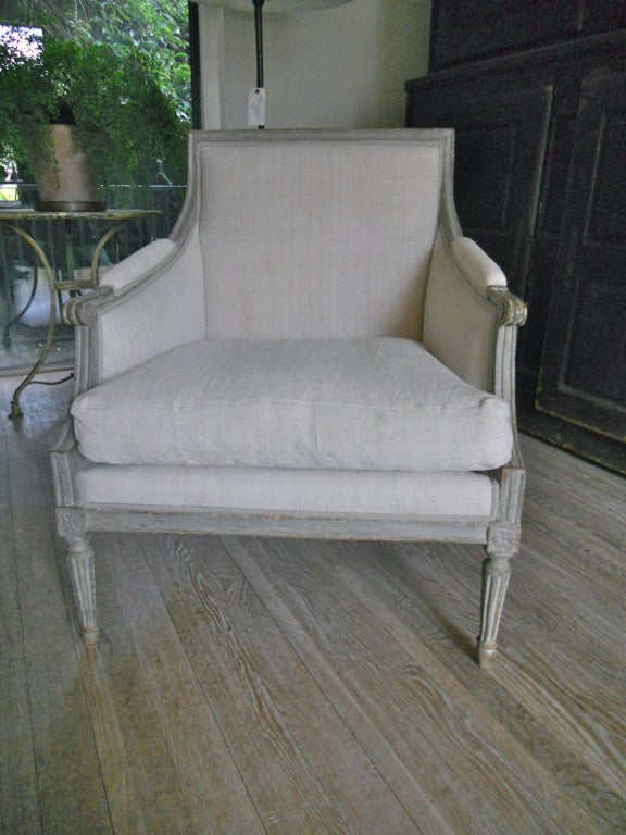 Handsome Swedish period bergere in the LouisXVI manner.Large size,original paint.Upholstered in antique rough linen.