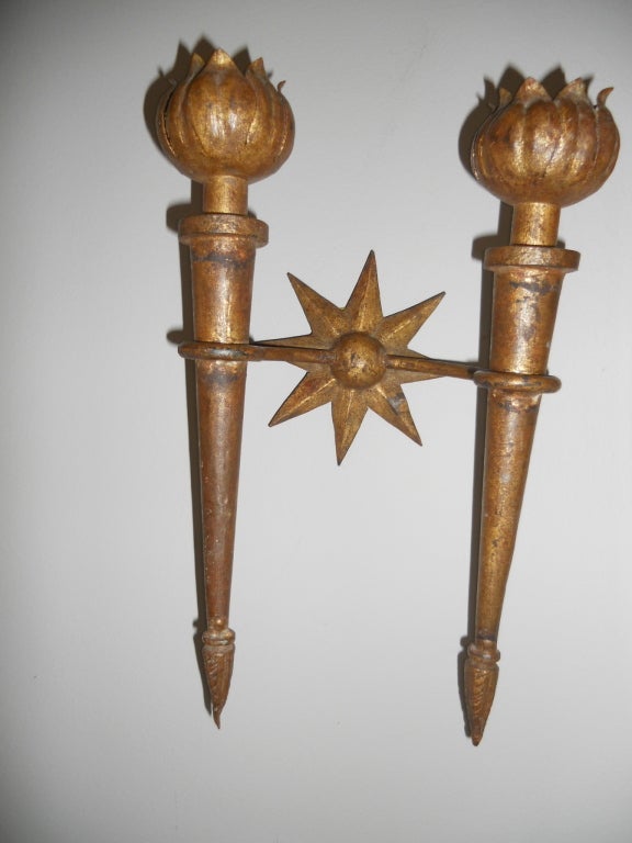 Handsome pair of French mid 40's gilt iron sconces by Gilbert Poillerat. Hand forged, slight difference in depth.