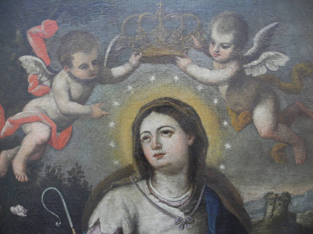 17th century religious painting of the Virgin Mary from Naples, Italy. The subject’s head is surrounded by a halo of 12 stars. According to the story of the Marian Assumption, Mary was assumed into heaven with a halo of stars. 

Upon her