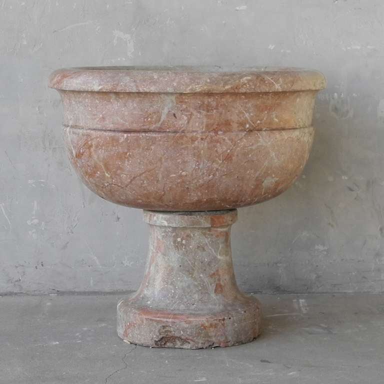 This marble fountain originally resided in a villa in Bergamo, a town in the Lombardy region of Italy, circa 1700. It's warm and interesting color make this a unique piece. Perfect for a fountain or a powder bath sink, this marble element is waiting