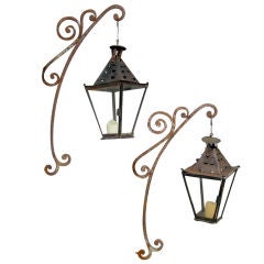 Pair 19th c. Iron Potence with 19th c. Tole Lanterns