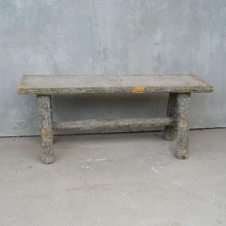 Antique faux bois cement bench.  Carved detail on cement legs.  Flat seat.