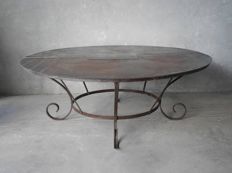 This Large Antique Iron Table originally graced the courtyard veranda of a maison particulaire in Aix-en-Provence, France. At over 6 and a half feet in diameter, this iron table is an impressive size and could easily seat an intimate dinner party.