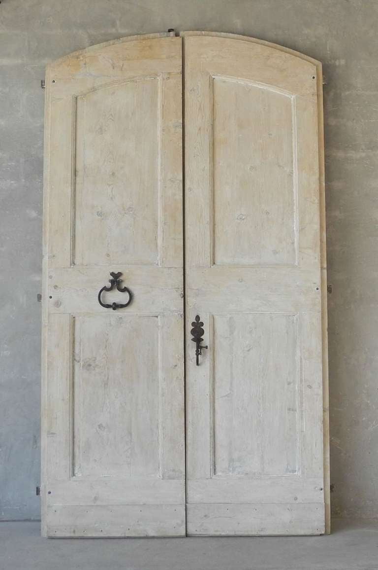 This pair of 18th century entrance doors originally stood at the front of a casa de campagna outside of Sesto Imolese, a village in the Italian Province of Bologna. At over 10 feet in height, these doors are monumental in size and would add an