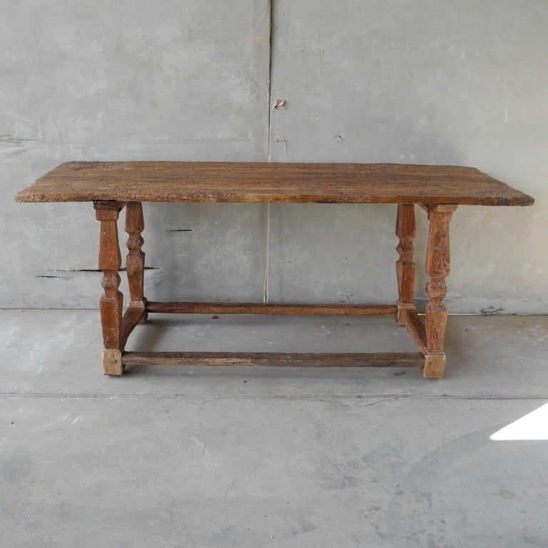 This Renaissance console table of Walnut is circa 1500. It is one of our oldest pieces, with plenty of beautiful aged marks and an interesting patina. It is perfect as a console table, work table, kitchen table, and more - super versatile due to