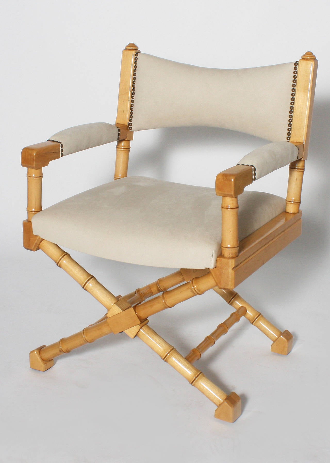 Pair of Director X-base chairs in a merisier finish.