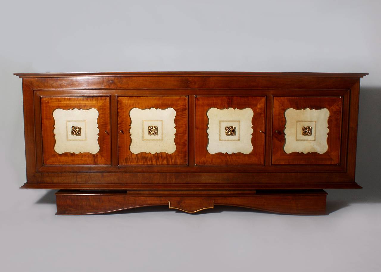 French Merisier (cherry wood) buffet with original parchment inlay and bronze mermaid mounts. All hardware, shelves and parchment are original. Tall buffet standing 39 1/4