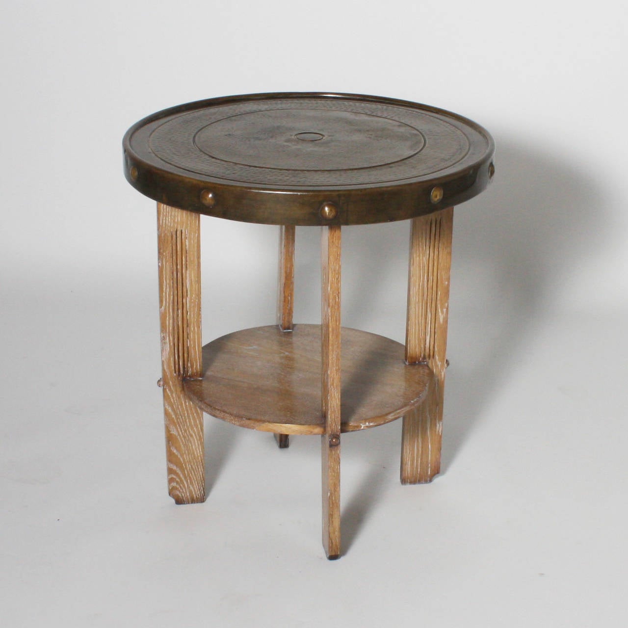 Cerused oak and hammered brass table