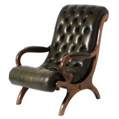 Pair of tufted library chairs in original green leather