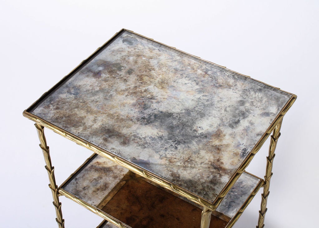 Pair of cigarette tables by Bagues with shelves