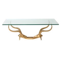 Ram’s head bronze base coffee table with glass top