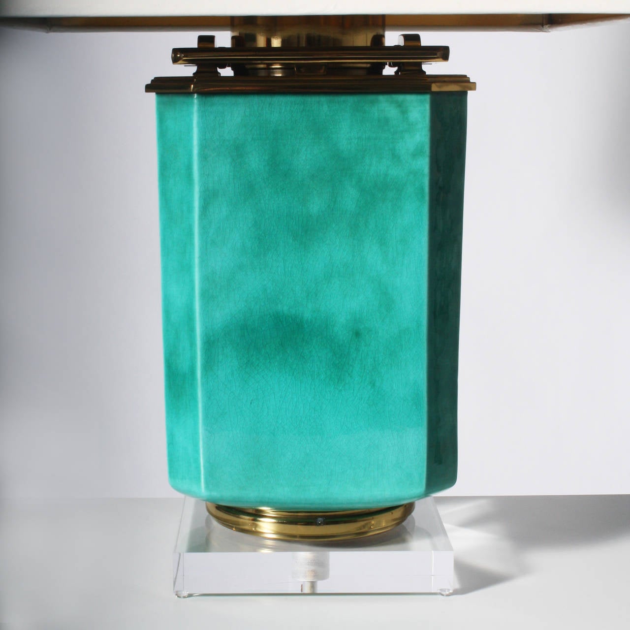 Stiffel Turquoise Ceramic Lamp. Ivory lacquer shade with gold foil interior. 3 way socket, 50/100/150 watt. Brass hardware. Lucite base. Crystal ball finial. Gold twisted cording.