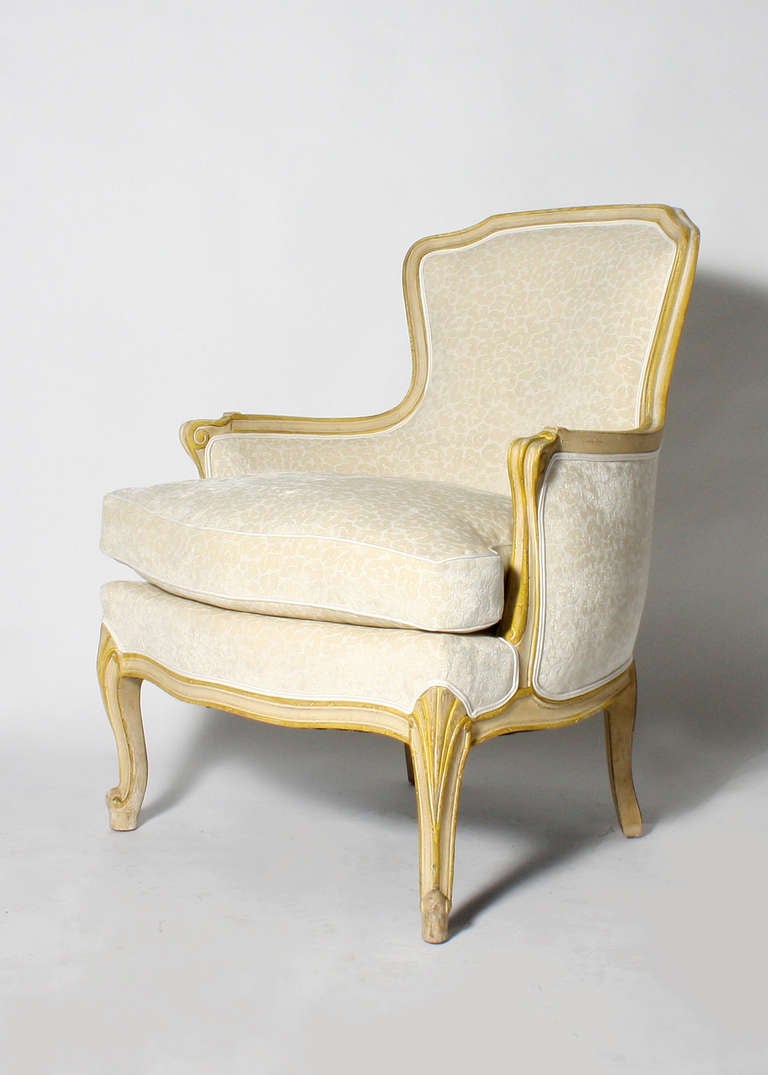 Louis XV style bergere in ivory fabric. Fabric is a Kravet animal print in ivory. Wood finish on the chair is original.