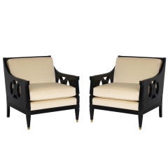 Pair of ebonized club chairs upholstered in ivory mohair