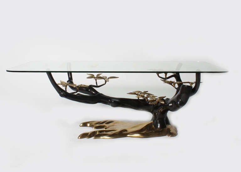 Oval glass table with metal and brass limbs and leaves-Jacques Duval-Brasseur