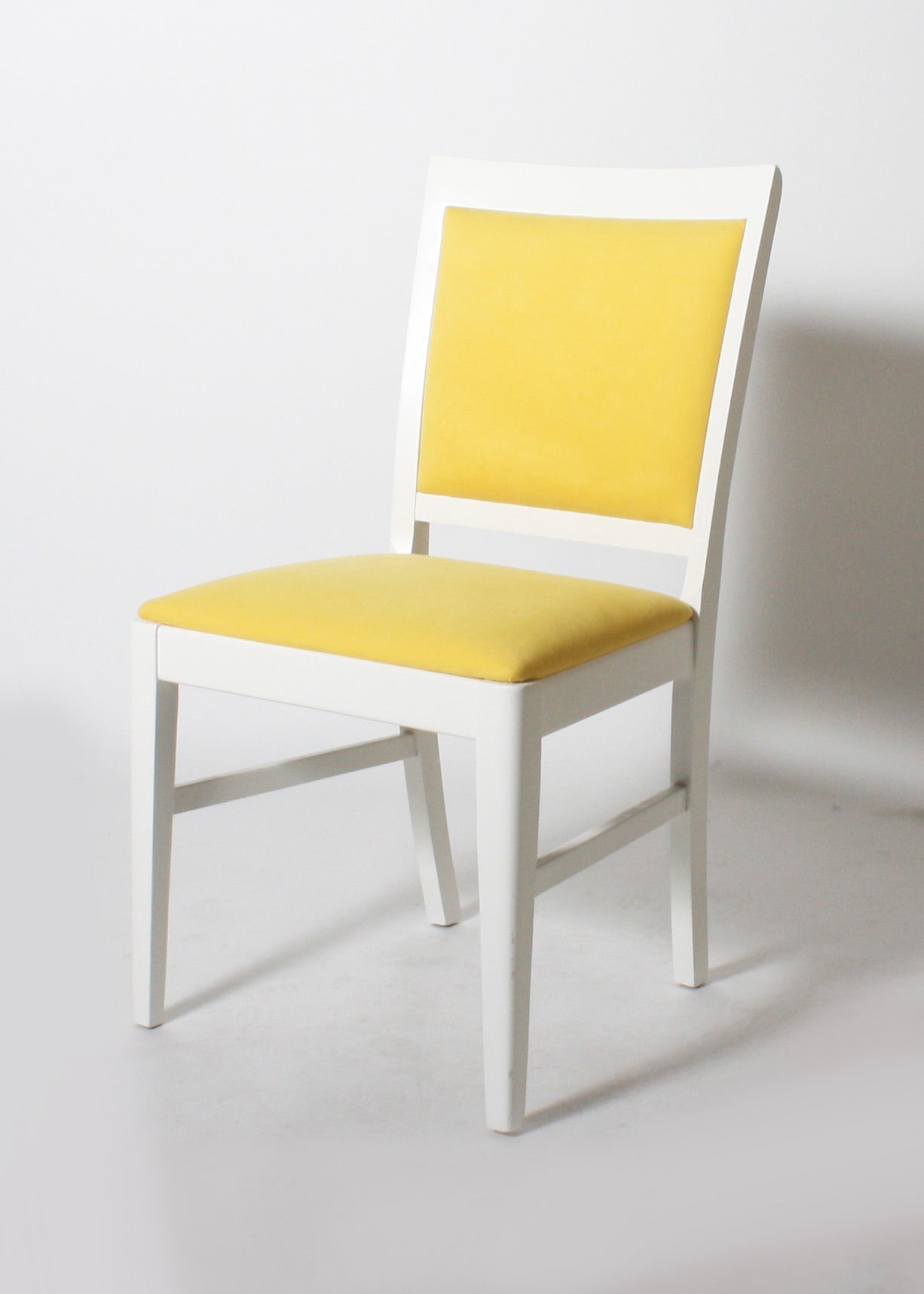 Ivory lacquered loop side chair.