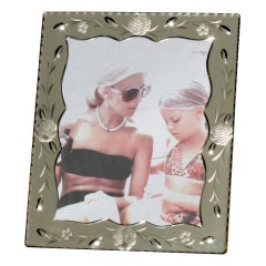 Mirrored frame with deep geometric beveling and floral etching