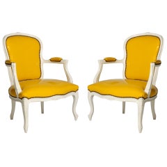 Pair of ivory lacquer fauteuils