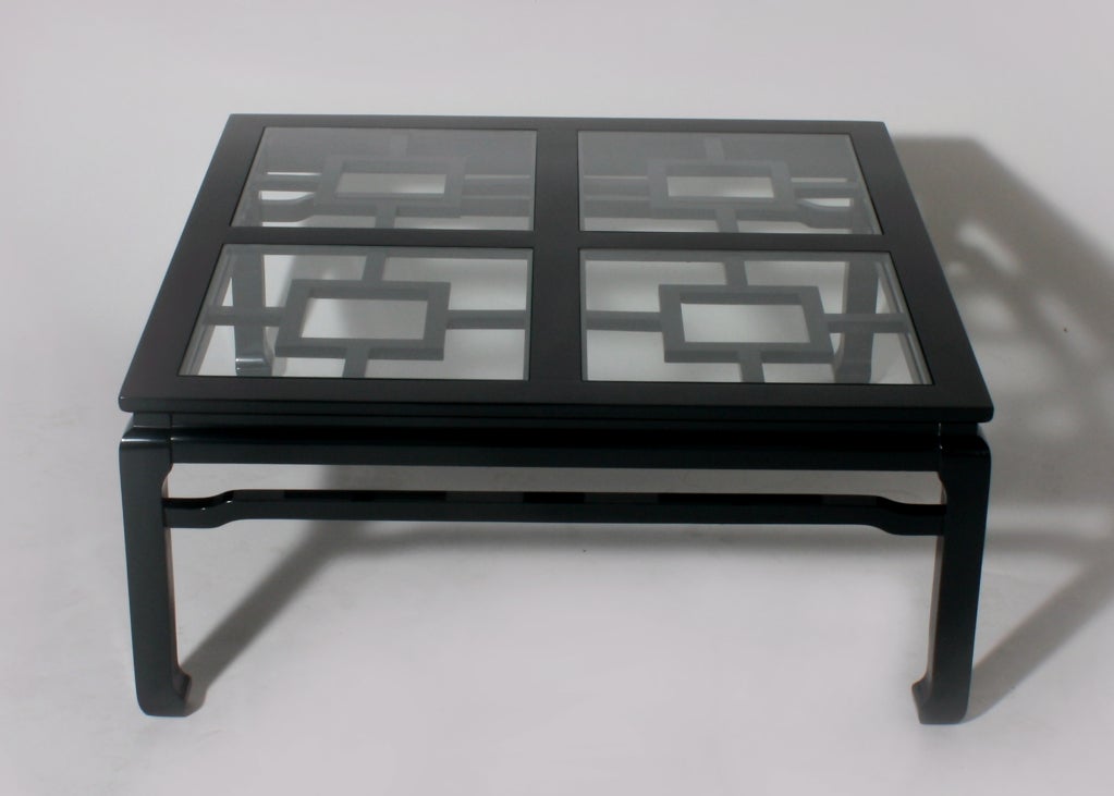 Fretwork coffee table in black forest green lacquer with glass inset