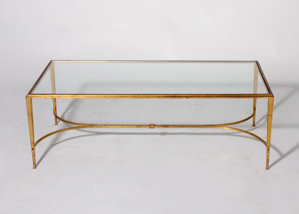 Gold leafed French Ramsey iron coffee table with clear glass top