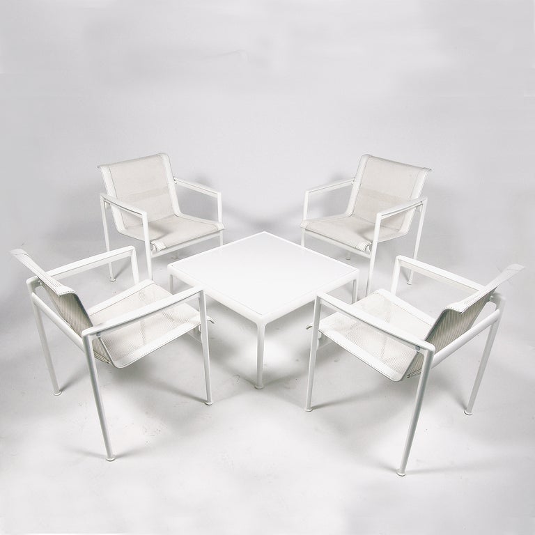 Richard Schultz 1966 Collection, four white powder coated aluminum armchairs with white vinyl trim and mesh seating, with low white enamel painted metal table. Originally designed for Knoll, this set by Schultz's own company from circa 2000.
Chair