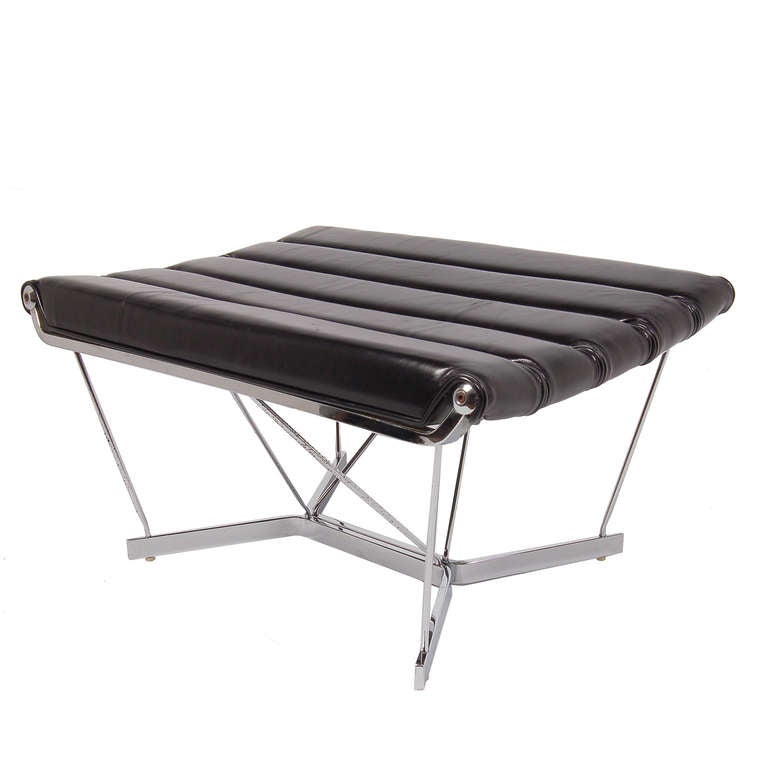 Hard to find ottoman, model 6381, from the Catenary Group, chromed steel rod base and leather channeled seat. Made by Herman Miller.