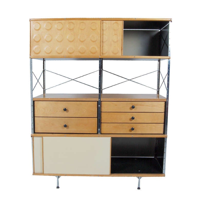 Original second production storage unit, two dimple doors, six drawers and two lower sliders. Neutral colored panels on metal frame and legs. Great condition, retains all glides and label. Made by Herman Miller.