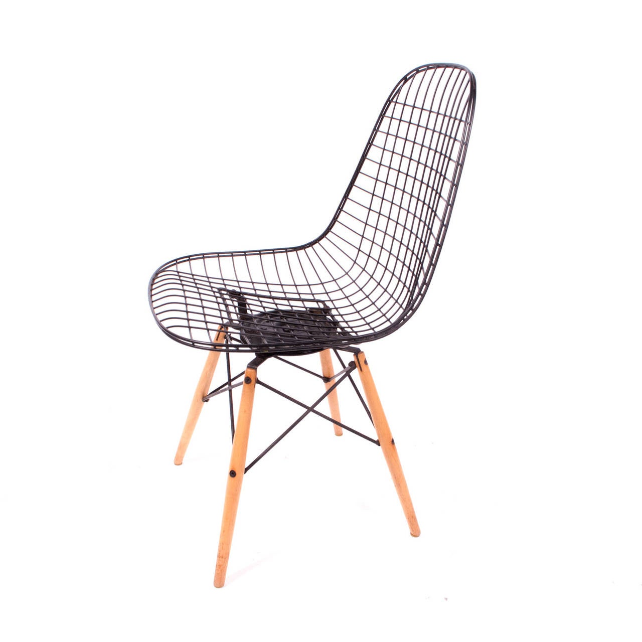 All original Charles and Ray Eames PKW chair by Herman Miller, black wire seat with brown wool seat pad, birch dowel legs with black wire struts, 18