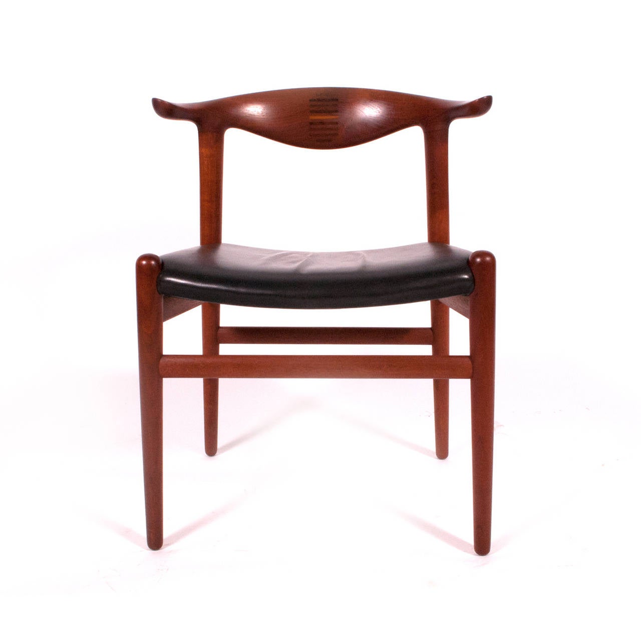 Original production Johannes Hansen solid teak with rosewood inlay back cowhorn chair, original leather seat, retains libels from cabinet maker and Knoll paper sticker, all original condition.