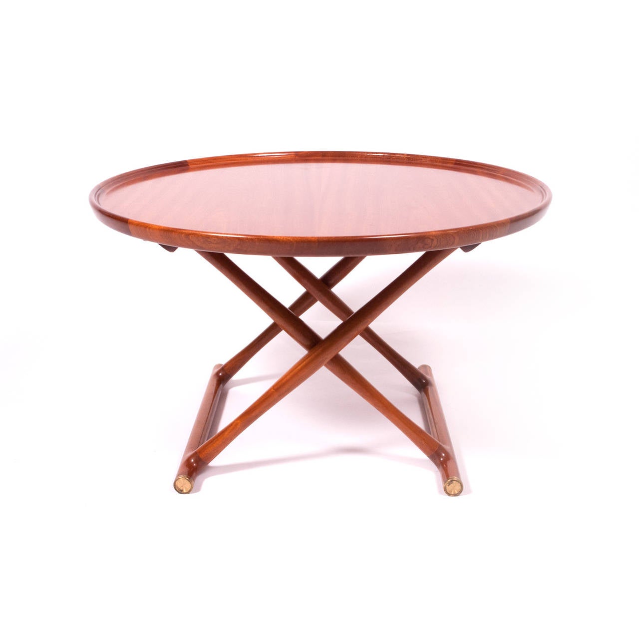 Beautiful occasional table, mahogany with brass detail. Table folds for storage. Made by Rud Rasmussen