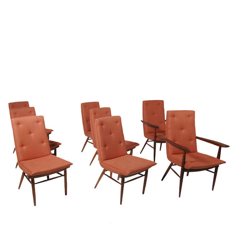 Two arm and six side chairs, model 206W, solid walnut frames with newly upholstered seating. Paddle shaped arms on tapering legs. Arm chairs measure 22.25